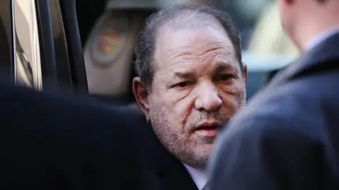 Getty Images Harvey Weinstein enters a Manhattan court house as a jury continues with deliberations in his trial on February 24