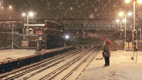 Getty Images commuter waiting for a train