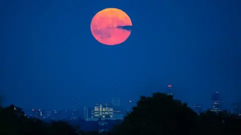 Ian Parkes Supermoon Rising over Birmingham taken from Sedgley