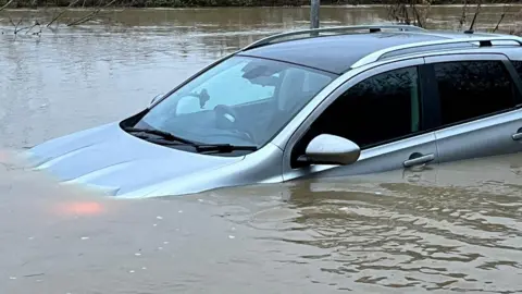 Essex County Fire and Rescue Service Car in water at Buttsbury Wash, Essex