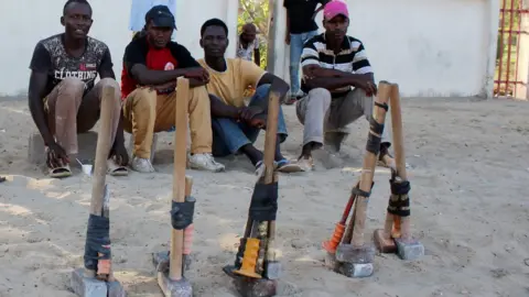 Reuters African migrants sit on the side of a road as they wait for work in Misrata, Libya 22/10/2017