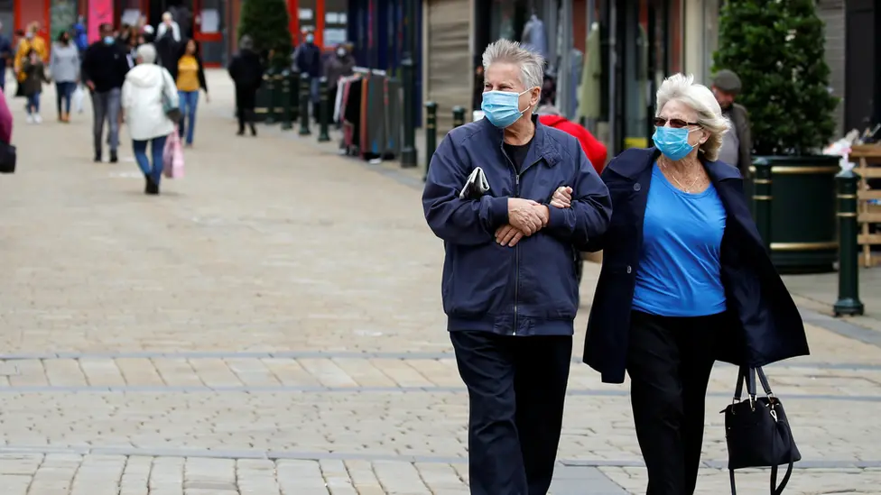 Reuters couple walking in Oldham