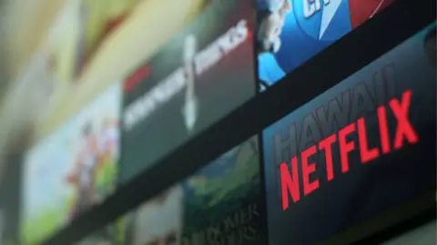 Mike Blake The Netflix logo on a smart TV