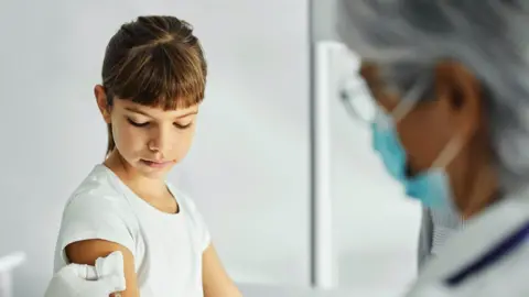 Getty Images Picture of girl having a vaccine