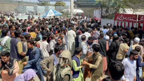 Reuters Crowds outside airport