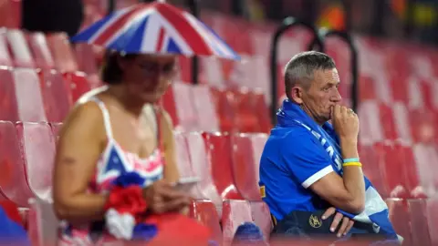 PA Media Rangers fans at the end of the match