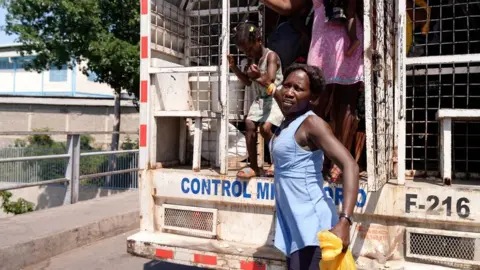 BBC Haitians get off a lorry carrying undocumented migrants to the border