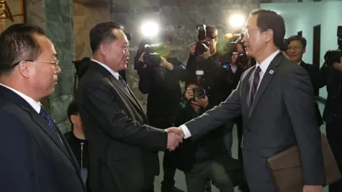 EPA South Korean Unification Minister Cho Myoung-gyon (R) shakes hands with North Korea"s Committee for Peaceful Reunification chairman Ri Son-gwon (2-L) at the Tongilgak building on the northern side of the border of the truce village of Panmunjom, North Korea on 29 March 2018.