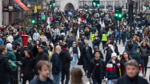 PA Media Christmas shoppers in Regent Street, London