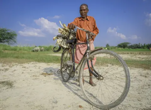 BBC Mr Lal carries the bones on his cycle