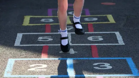 Getty Images File picture of a girl playing hopscotch