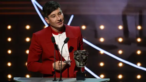 Getty Images Barry Keoghan accepting his Bafta for best supporting actor