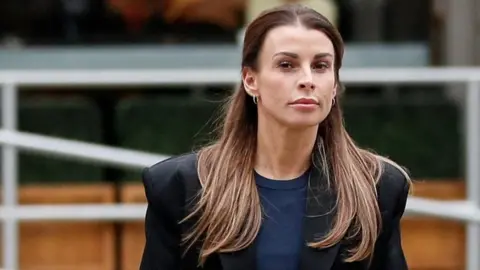 Reuters Coleen Rooney leaving court.