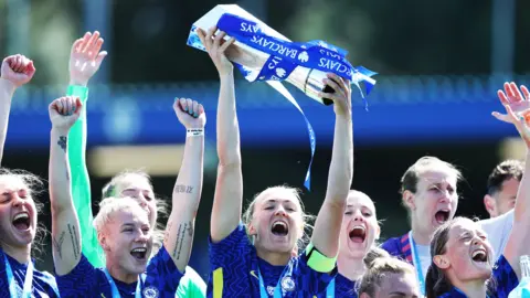 Chelsea celebrate with the WSL trophy