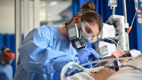 Getty Images Staff care for a patient in critical care at Royal Papworth hospital in Cambridge