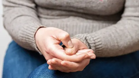 Getty Images Woman sitting nervously