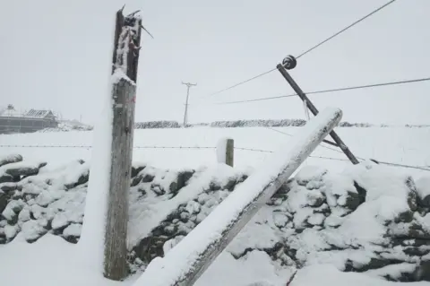 Energy Networks Association Broken power pole down in the snow