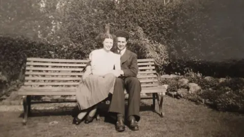 Norma Beasley Norma and Bob Beasley on a bench looking very much in love