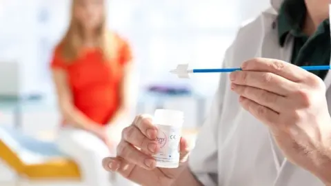 Science Photo Library Patient preparing for cervical screening