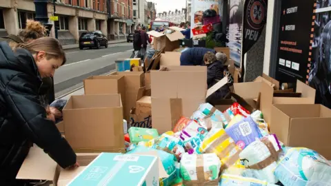 Tricia de Courcy Ling Donations gathered outside the restaurant