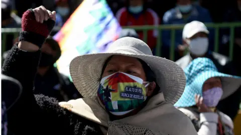 Getty Images Supporters of Bolivian former president (2006-2019) Evo Morales take part in a open deliberative meeting (Cabildo, in Spanish) asking for the resignation of President Jeanine Anez in El Alto, Bolivia, on August 14, 2020 amid the COVID-19 pandemic