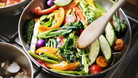 Getty Images Mixed vegetable stir fry in a pan