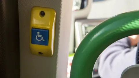 Getty Images Disabled button on a bus