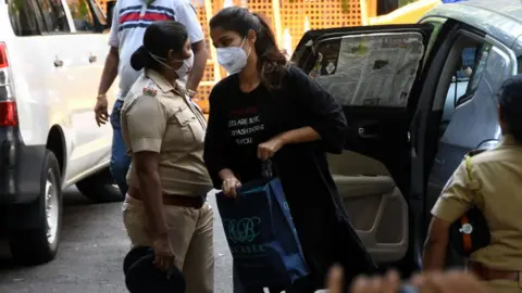 Getty Images Rhea Chakraborty outside NCB office after being summoned for questioning in connection with Sushant Singh Rajput's death case at Ballard Estate on September 8, 2020 in Mumbai, India.