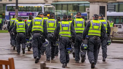 Getty Images Police in George Square, Glasgow