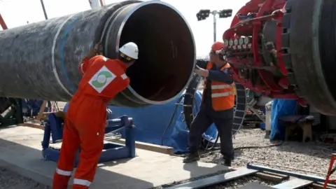 Reuters Construction workers on the Nord Stream 2 pipeline in Russia