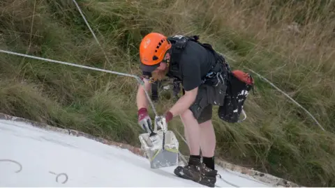 Tim Rubridge and English Heritage Work being carried out on the carving