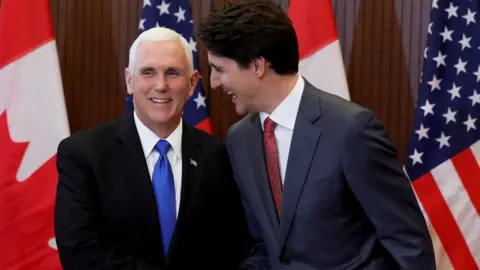 Reuters Canada PM Justin Trudeau and US Vice President Mike Pence shake hands in Ottawa