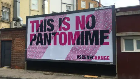 Max Jones A billboard reading: This is no pantomime