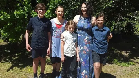 Katrina Miles/Facebook Photo of Katrina Miles and her children on her Facebook page