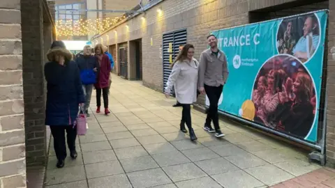 Martin Heath/BBC People leaving after a theatre show
