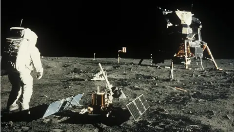 Science Photo Library Buzz Aldrin near the scientific equipment