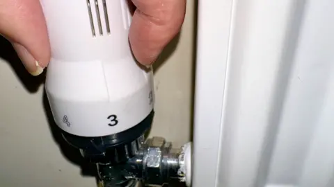 BBC A radiator being adjusted