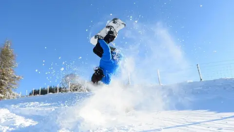 Wales News Service Snowboarder Oli Nayler performing a trick at Storey Arms in Powys