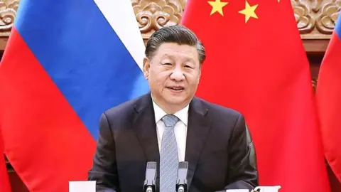 Getty Images Chinese President Xi Jinping is seen during a meeting with Russian President Vladimir Putin (not seen) via videoconference in Moscow, Russia on December 15, 2021.