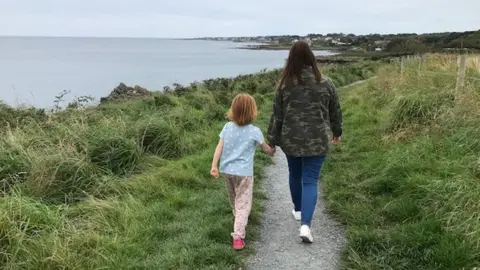 BBC Two people walking along the existing pathway at Orlock between Bangor and Donaghadee