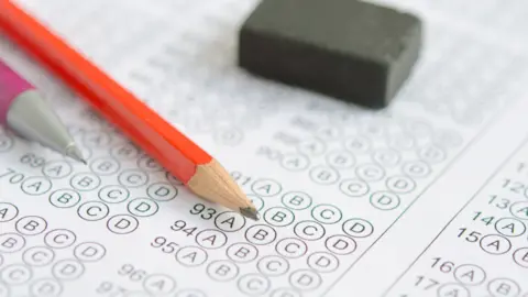 Getty Images Exam paper with pencil and rubber