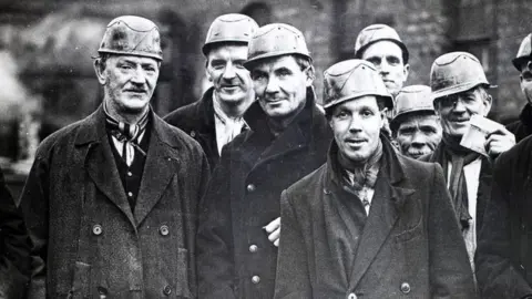 Getty Images A group of miners at the West Cannock Colliery, Staffordshire, wearing helmets and carrying safety lamps, circa 1940.