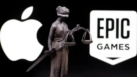 Reuters The Apple logo, the Epic logo, and a 3D-printed statue of the personification of Justice with sword and scales between them