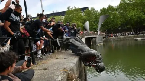 PA Media In Bristol a statue of slave trader Edward Colston was pushed into the harbour