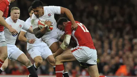 Paul Ellis/Getty Wales' Jamie Roberts Tackles England's Manu Tuilagi at an international rugby union match