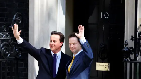 Getty Images David Cameron and Nick Clegg just after the formation of the Conservative-Liberal coalition in 2010