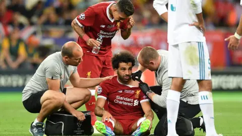 AFP Mohamed Salah receives treatment during the Champions League final