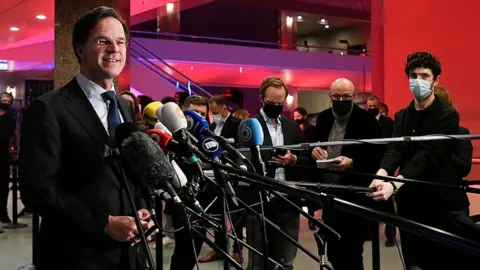 Reuters Dutch Prime Minister Mark Rutte reacts to the exit polls in the Netherlands general election in The Hague, Netherlands, March 17, 2021