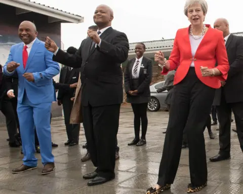 PA Prime Minister Theresa May dancing at ID Mkhize Secondary School in Gugulethu, Cape Town, South Africa - Tuesday 28 August 2018