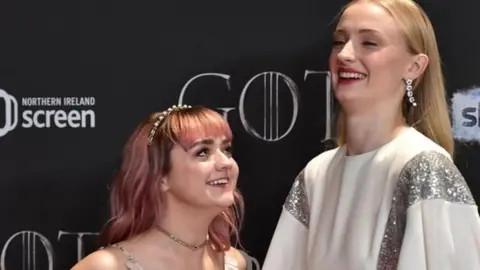 Getty Images Maisie Williams and Sophie Turner share a laugh at the premiere